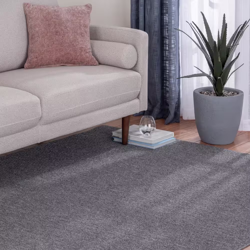 TrafficMaster Heavy Traffic Gray Solid Color 8 ft. x 12 ft. Carpet Remnant Area Rug