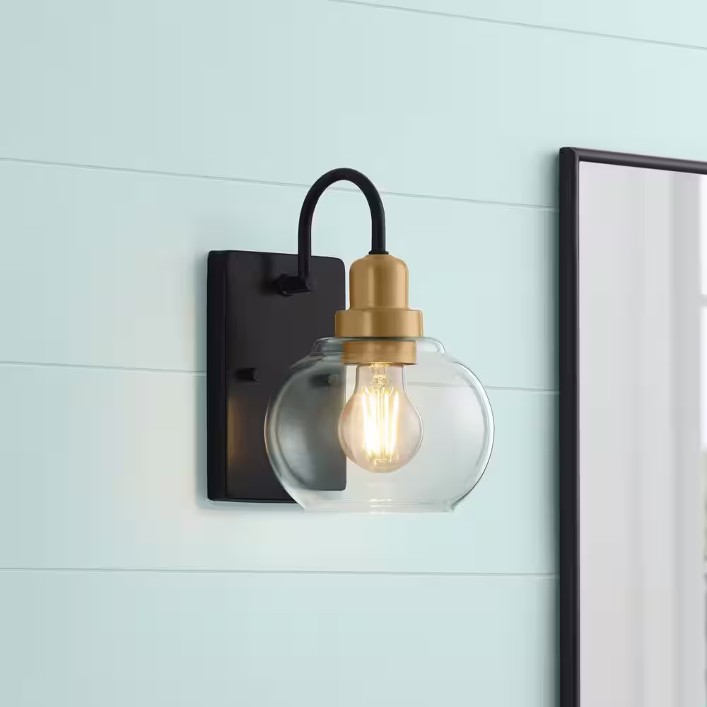 Home Decorators Collection Halyn 4.5 in. 1-Light Industrial Black Indoor Wall Sconce with Vintage Brass Accents and Clear Glass Shade